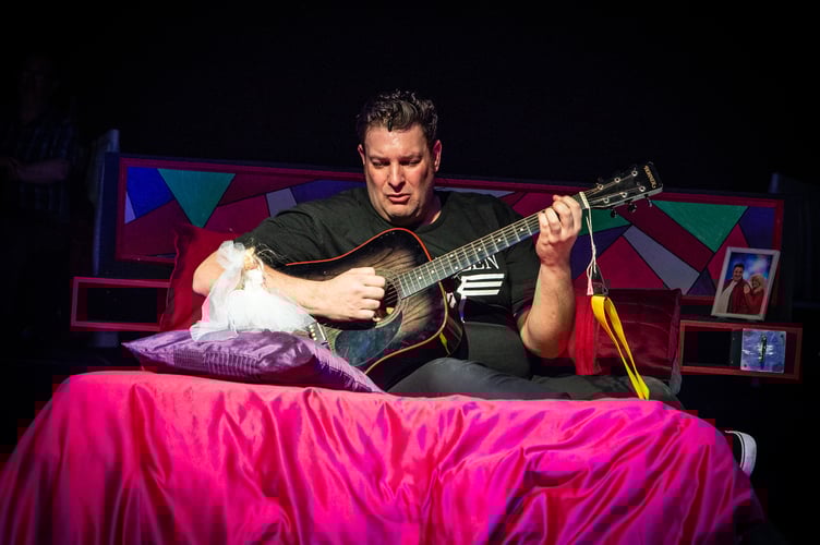 James Billington as Robbie, the wedding singer during the bed scene. Image: Mike Palmer.