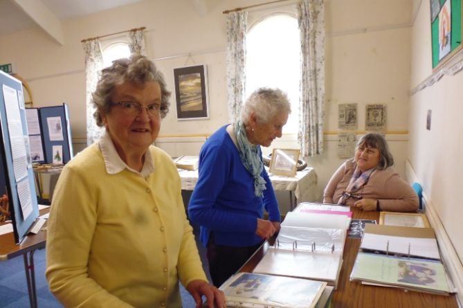 Visitors and members looking at exhibits