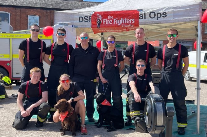 Crediton firefighters who are taking part in a rowing challenge in Crediton Town Square until about 4pm today, Sunday, April 21.  AQ 0589
