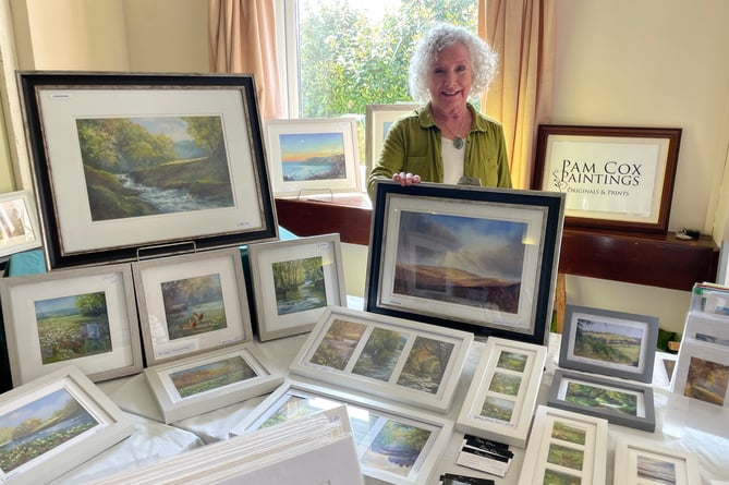 Pam Cox of Morchard Bishop sold some of her paintings and prints at the Craft Fair and Coffee Morning at Sandford.  AQ 0110
