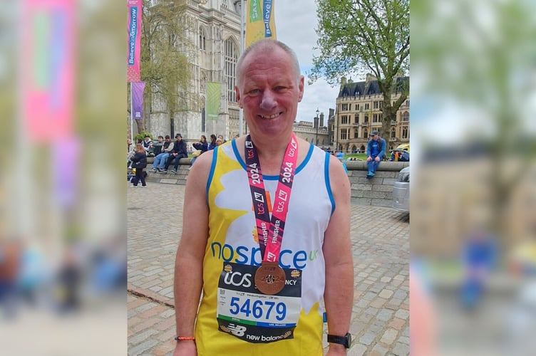 Ian Webber with his medal after completing this year’s London Marathon.