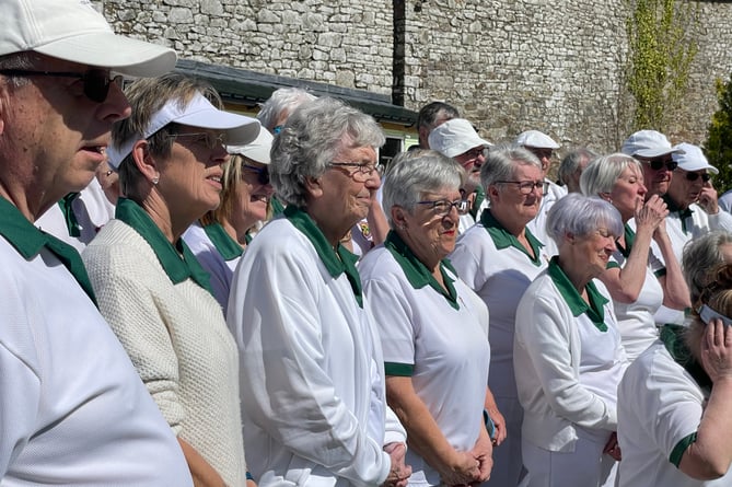 North Tawton bowlers listening to speeches at the opening of the season.  AQ 0514
