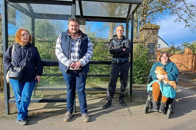 Residents of Witheridge at the bus stop, Emily Gilbert, Cllr Peter Jones, Dan Paton and Naomi Ainsworth. Image courtesy: Peter Jones

