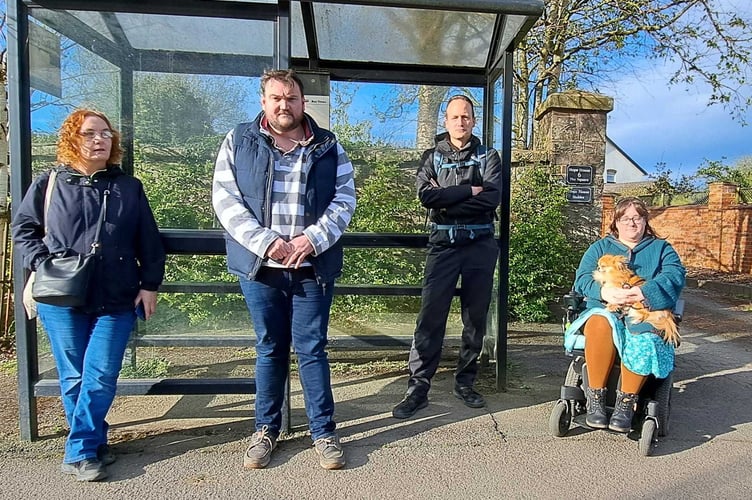 Residents of Witheridge at the bus stop, Emily Gilbert, Cllr Peter Jones, Dan Paton and Naomi Ainsworth. Image courtesy: Peter Jones