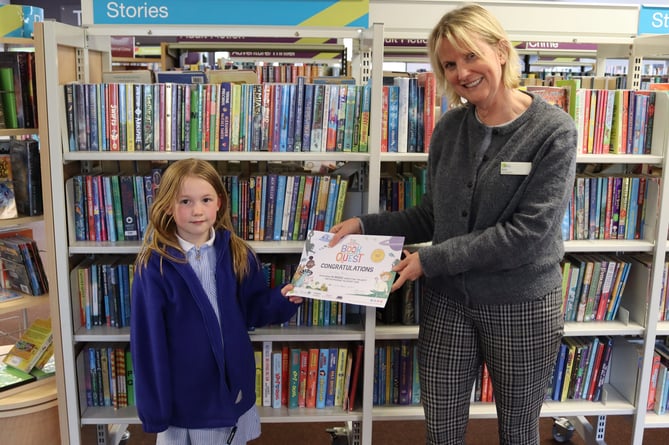 Lily-Ann receiving certificate at Crediton Library