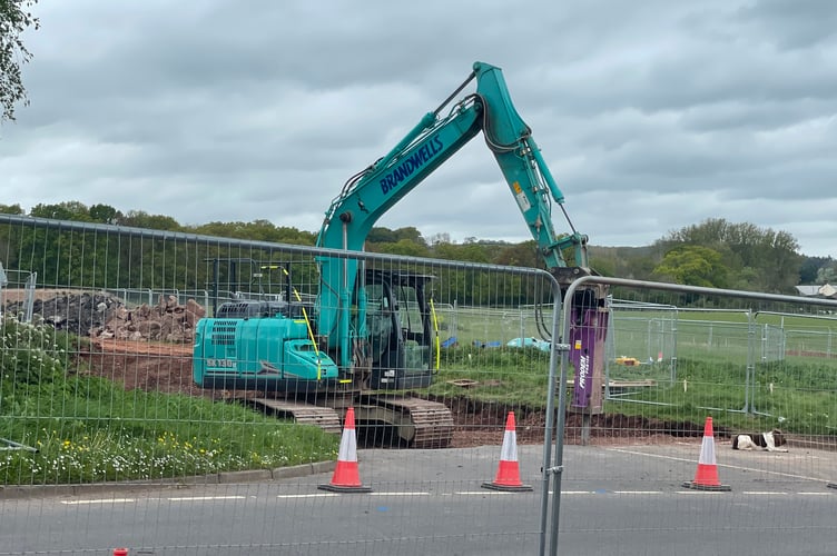 Removing the road surface to build the roundabout at Exhibition Corner.  AQ 1176