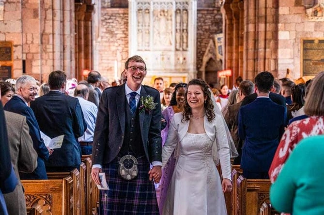 Walking down the aisle after their marriage.  Image: Hannah Frost
