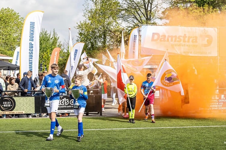 Walking out onto the pitch in Dokkum.
