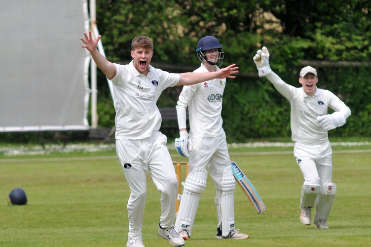 Devon Cricket LeagueA Division. Abbotskerswell versus Bridestowe. Bridestowe bowler Etahn Guest and 'keeper Patrick Ewen are vocal in their appeal for lbw - but Abbotskerwell batsman James Tyler is safe for now