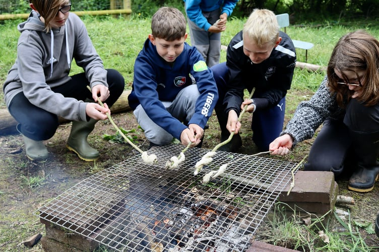Making damper bread over fire