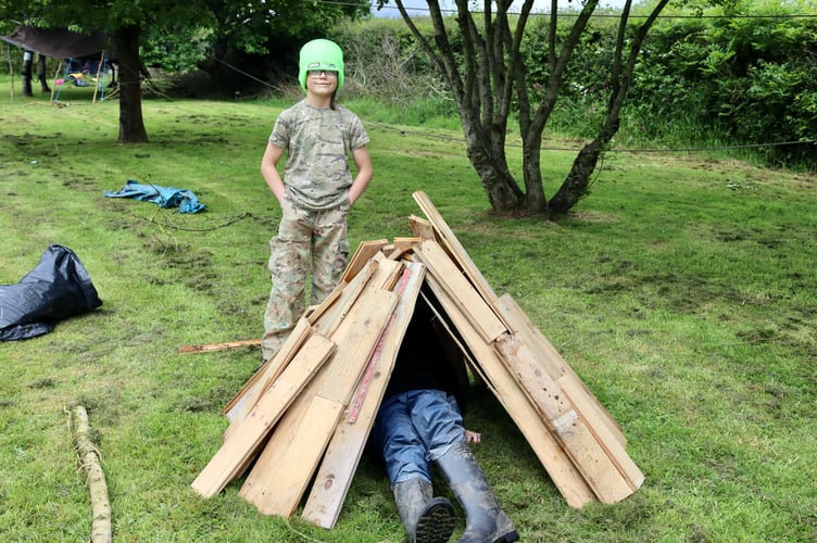 Proud builder of wooden teepee