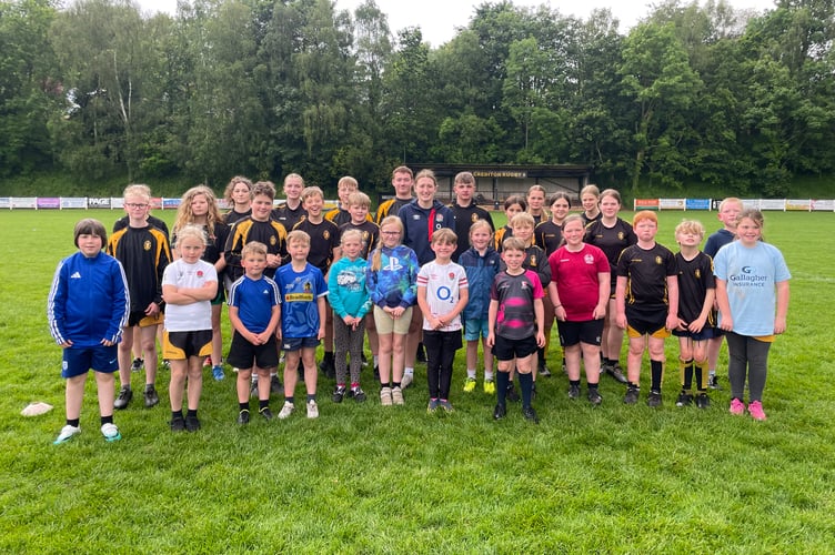 Guinness Women's Six Nations rugby player Emma Sing with some of the young people at Crediton RFC Tag Rugby event.  AQ 3168