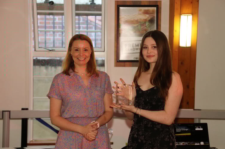 Imogen Cunningham, right, received the Daphne Cartwright Award from Vicky Evans.  AQ 4138
