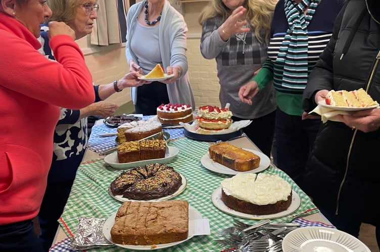 Serving refreshments after the clock switch-on ceremony at Down St Mary.  AQ 0967
