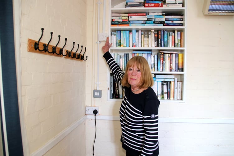 Tessa Pluck switching on the clock at Down St Mary. AQ 4108