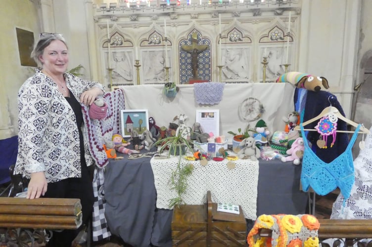Claire Borlase with soft toys made by a small group in aid of equipment for the village surgery