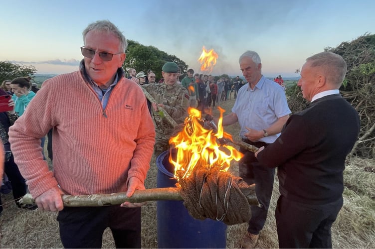 Preparing torches to light the beacon