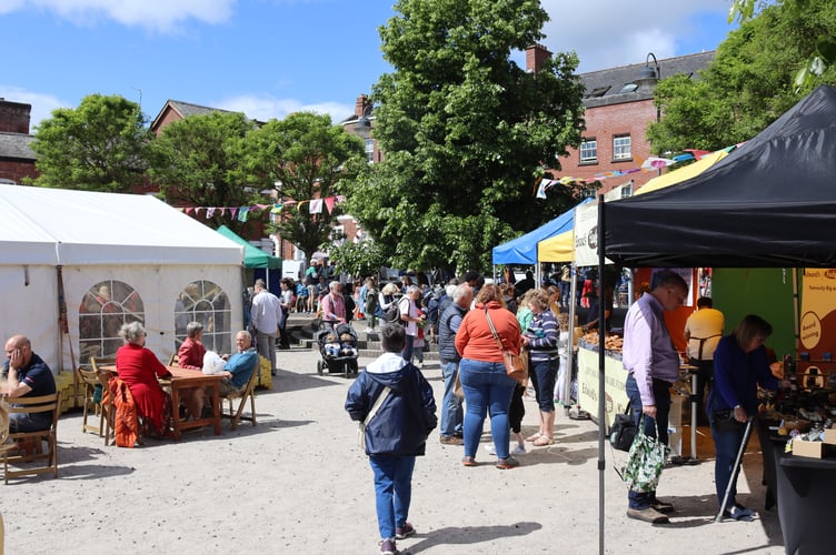 People enjoying various stalls Crediton Food and Drink Festival 2024