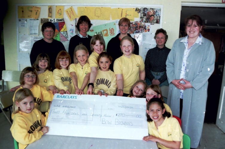 In April 2001, Bow Brownies presented a cheque for £270 to Devon Air Ambulance, raised at a pledge auction. DSC00669