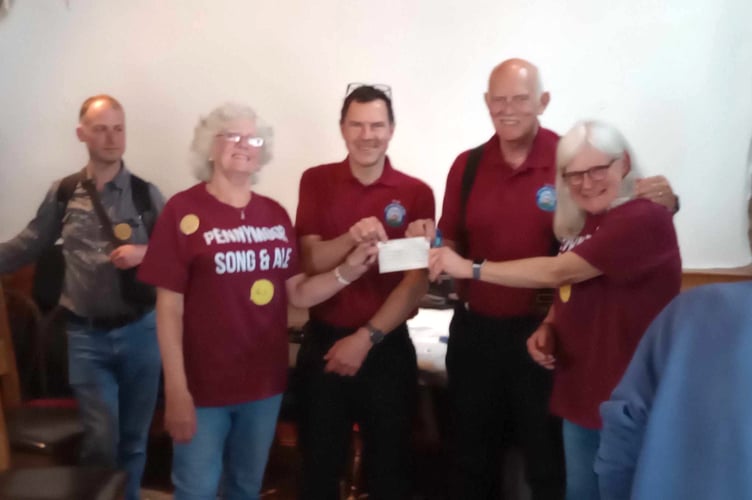 At the presentation of £435 to SW Blood Bikes from Pennymoor Singaround.