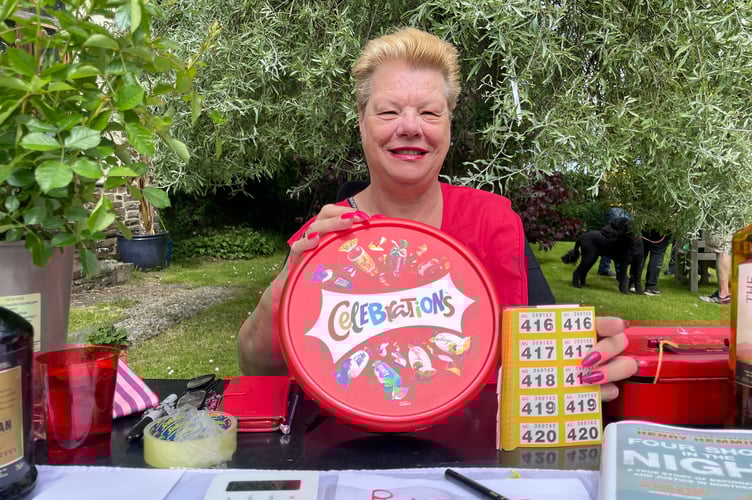 Susan P Tribble ran the raffle at the Open Garden event.  AQ 5307