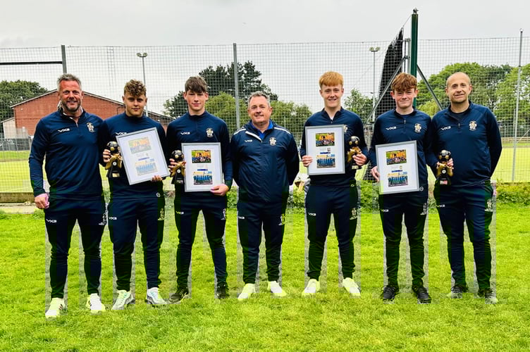 Some of the Crediton Youth FC U16s with their long service awards