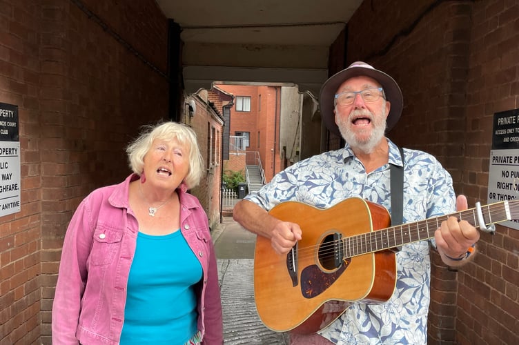 Hazel Underwood and Paul Watts, the Sagalouts, performing in Crediton High Street. AQ 5588