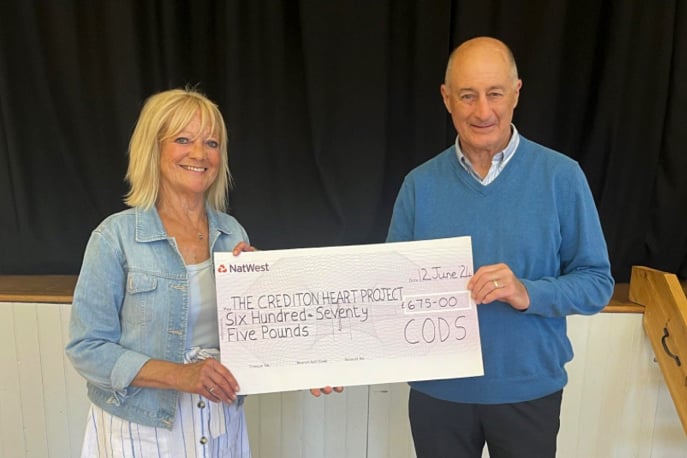 Carol Stoyle from CODS presenting the cheque to Dennis Mardon from Crediton Heart Project.