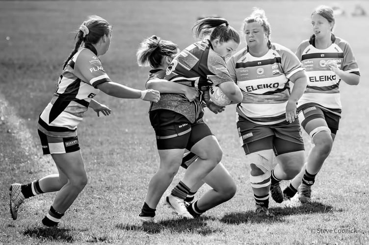 Sophie Lyon powering through with the ball.
