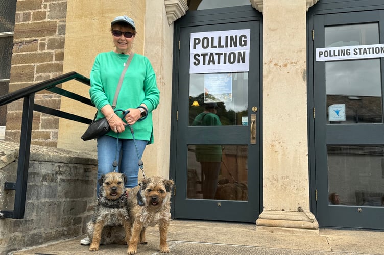 Dogs are not permitted inside polling stations but many people take them along and wait while someone else votes.  AQ 6733
