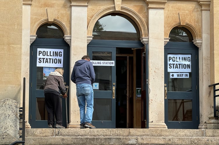 Going in to vote at Crediton Congregational Church. AQ 6724