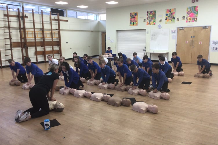 During CPR training at Landscore Primary School.