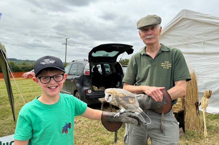 Louie Evans (9), enjoyed meeting a barn owl from North Devon Hawk Walks. AQ 6236