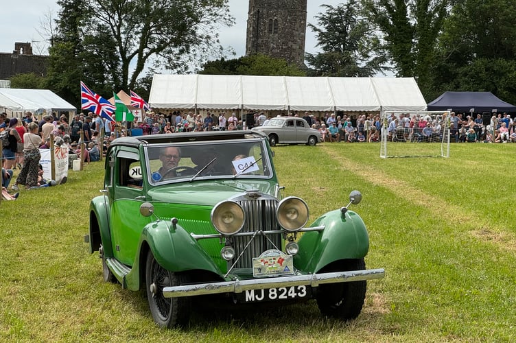 During the grand parade of vintage cars. AQ 6390