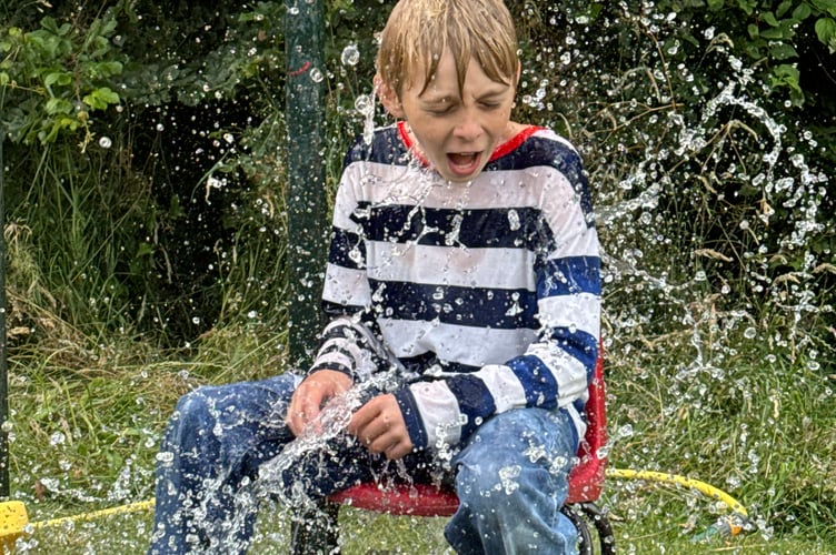 The Wet the Rector, throwing the sponge at a target game was pretty wet for the volunteers sat under the bucket! AQ 6997