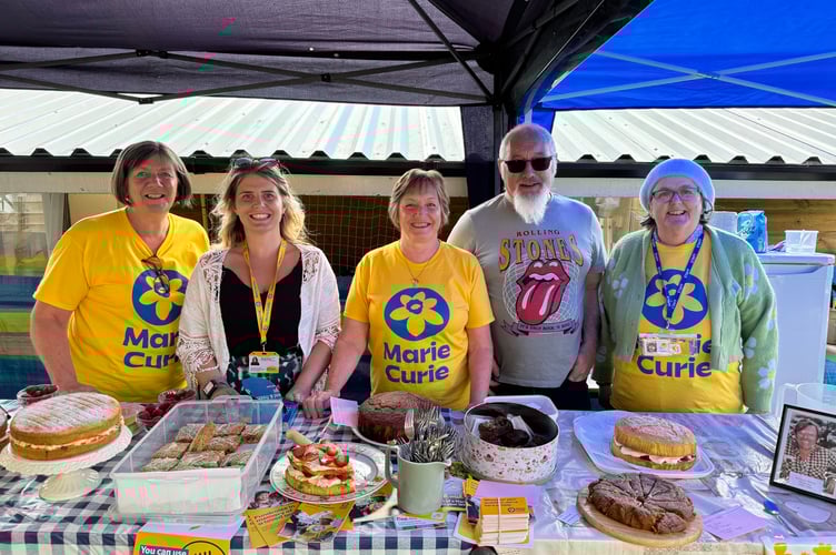 Behind the teas stall at the Broad Close Marie Curie fundraiser, from left, Christine Elsworthy, Georgia Brooks, Gill and Alfie Pearn and Sandra Martin. AQ 7013