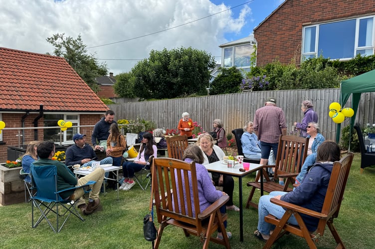 In the garden at the Marie Curie Tea Party held at Moor View, Broad Close, Crediton. AQ 7017