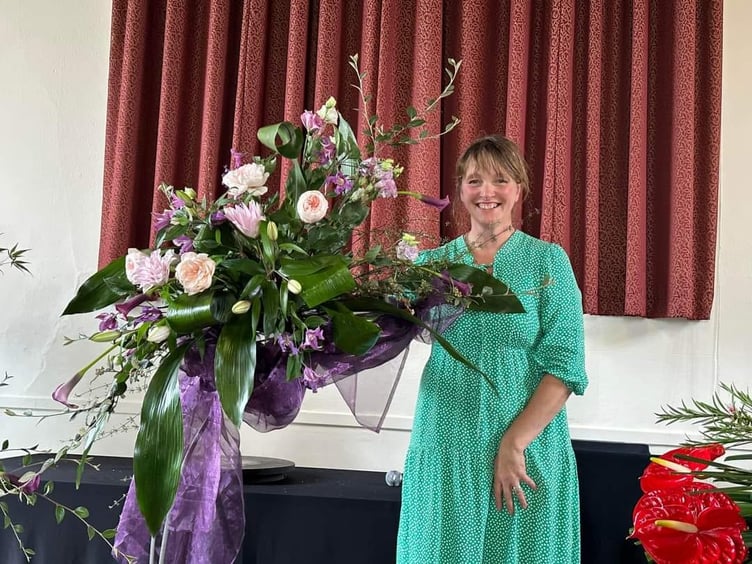 Floral demonstrator Alison Penno created a special arrangement to mark the 40th birthday of Sampford Courtenay Flower Club – with references back to 1984