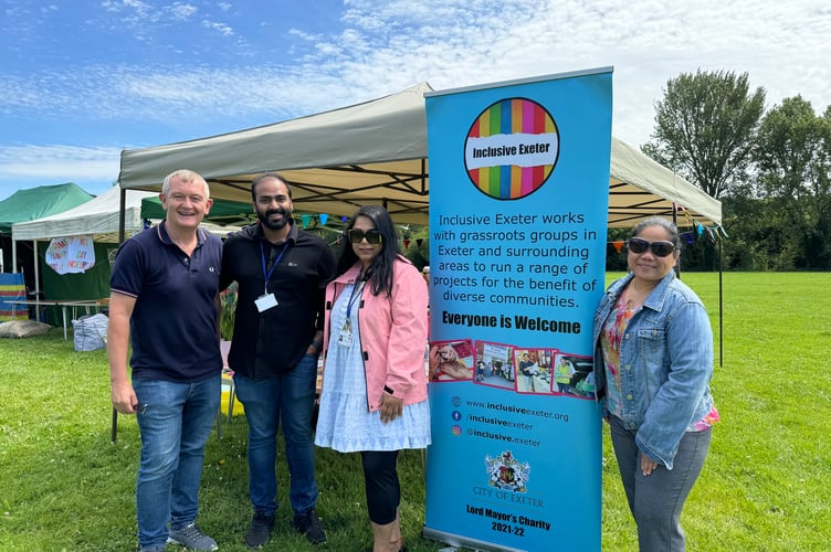 On the Inclusive Exeter stall were, from left, Director Alan Quick, Better Connections Project Manager Mathew Jose Mangatt, Project Co-Ordinator Mahsin Mahbub and Director Arlene Lewis. AQ 8086
