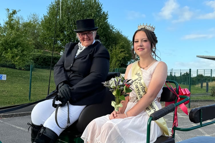 Carnival Queen Belle Tonkin sat in the horse drawn carriage with the carriage driver.  AQ 8664