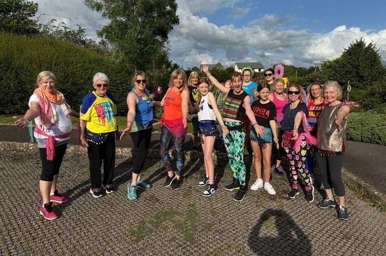 Zumba with Nat class members danced their way along the procession route.  AQ 8640