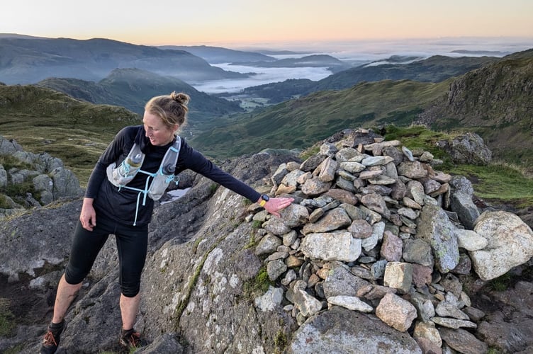 Gemma reaching one of the 42 Lake District Peaks.