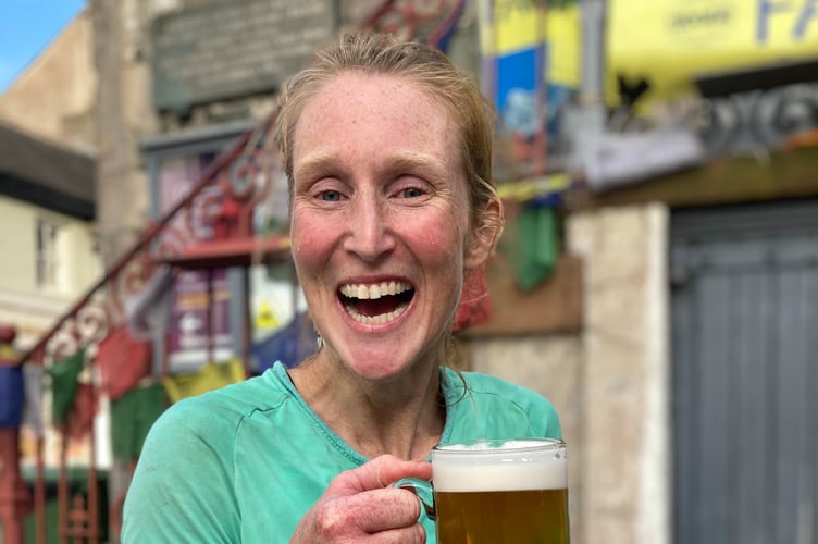 Gemma with her complimentary pint at the end of her challenge.