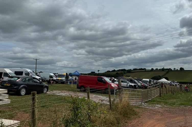 A busy field of vehicles and motorbikes at Crediton Raceway.  AQ 9187