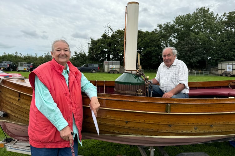 John Moore with his wife, Elizabeth and his SBA 2003 steam launch named Swallow. AQ 9018