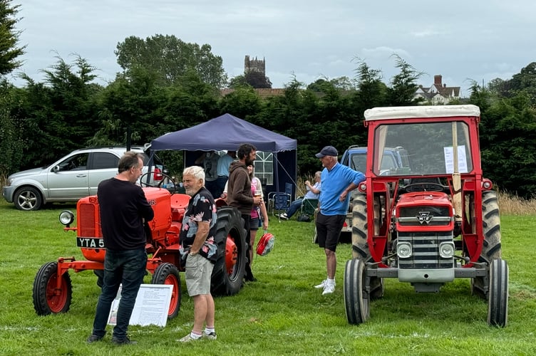 Talking about tractors at the Vintage Rally. AQ 9023