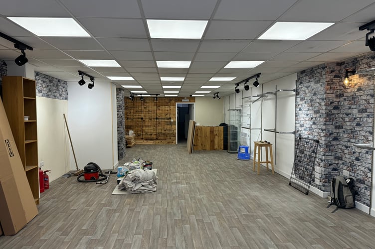 If needed. ….. Work is progressing on the interior of the Devon Air Ambulance charity shop. AQ 8388