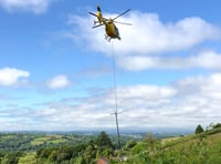 Helicopter replaces electricity poles near Tedburn St Mary