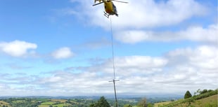 Helicopter replaces electricity poles near Tedburn St Mary