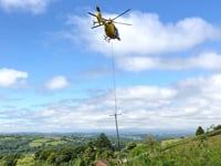 Helicopter replaces electricity poles near Tedburn St Mary